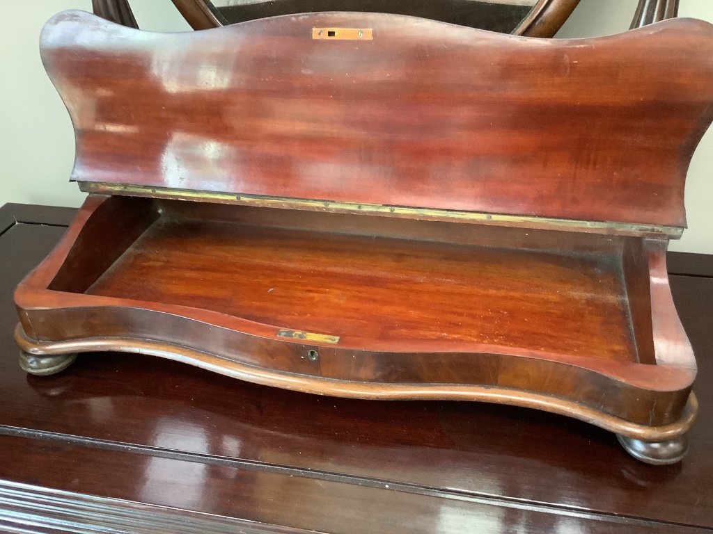 A Victorian mahogany toilet mirror, with hinged box base, width 72cm height 86cm